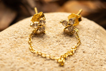 FLEUR DE CHAÎNE - Boucle d’oreille double avec chaînette et fleurs - Much Elegance